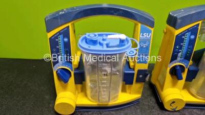 3 x Laerdal LSU Suction Units (All Power Up, 1 x with Damage and 1 x with Loose Casing) with 3 x Suction Cups, Hoses and 3 x Batteries - 2