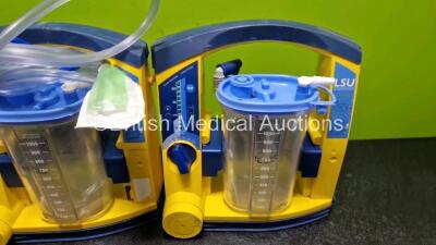 3 x Laerdal LSU Suction Units (All Power Up, 1 x with Damage and 1 x with Loose Casing) with 3 x Suction Cups, Hoses and 3 x Batteries - 4