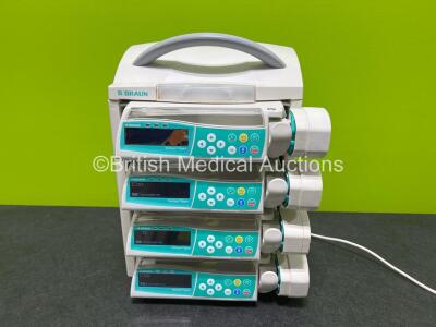 4 x B.Braun Perfusor Space Syringe Pumps with 1 x B.Braun Space Station and 1 x Power Supply (All Power Up, 1 x Damage to Screen - See Photos)