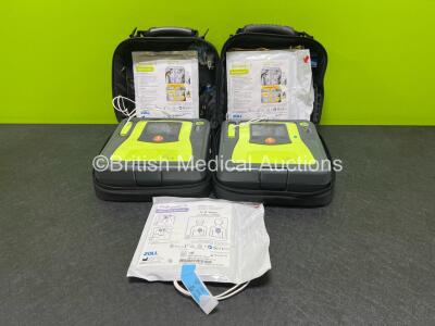 2 x Zoll AED PRO Defibrillators with 2 x LiMnO2 Batteries and 3 x Electrode Pads *2 in Date, 1 Expired* in Carry Cases (Both Power Up, 1 x Damage to Screen - See Photos) *SN AA14L034724 / AA14J033901*