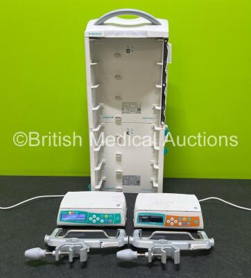 2 x B.Braun Infusomat Space Infusion Pumps (Both Power Up) with 2 x Power Supplies, 2 x B.Braun Space Stations (1 x Damaged / Missing Casing - See Photos) and 2 x Pole Clamps