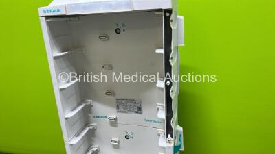 2 x B.Braun Infusomat Space Infusion Pumps (Both Power Up) with 2 x Power Supplies, 2 x B.Braun Space Stations (1 x Damaged / Missing Casing - See Photos) and 2 x Pole Clamps - 8