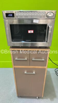 1 x Samsung MJ26A6053AT Commercial Microwave on Wooden Cabinet (Powers Up) *S/N 0C7X7WAT400080W*