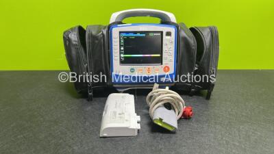 Zoll X Series Monitor/Defibrillator Application Version 02.34.05.00 (Powers Up and Passes Self Test, Cracked Handle - See Photo) Including Pacer, ECG, SPO2, NIBP, CO2 and Printer Options with 2 x Sure Power II Li-Ion Batteries and 1 x Paddle Lead *SN AR16