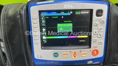 Zoll X Series Monitor/Defibrillator Application Version 02.34.05.00 (Powers Up and Passes Self Test, Cracked Handle - See Photo) Including Pacer, ECG, SPO2, NIBP, CO2 and Printer Options with 2 x Sure Power II Li-Ion Batteries and 1 x Paddle Lead *SN AR16 - 2