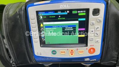 Zoll X Series Monitor/Defibrillator Application Version 02.34.05.00 (Powers Up and Passes Self Test, Cracked Handle - See Photo) Including Pacer, ECG, SPO2, NIBP, CO2 and Printer Options with 2 x Sure Power II Li-Ion Batteries and 1 x Paddle Lead *SN AR16 - 3