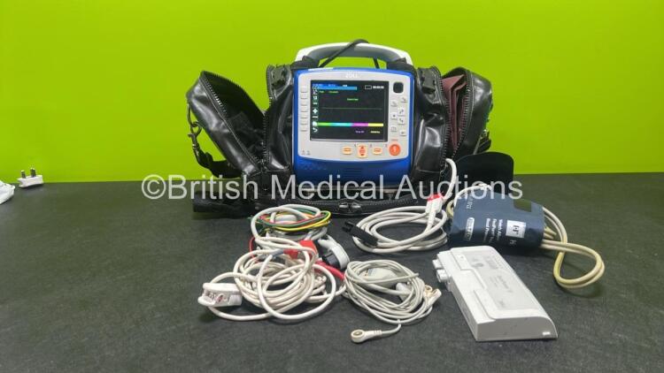 Zoll X Series Monitor/Defibrillator Application Version 02.36.21.00 (Powers Up and Passes Self Test) Including ECG, SPO2, NIBP, CO2 and Printer Options with 4 and 6 Lead ECG Lead, SPO2 Finger Sensor, NIBP Cuff and Hose, 2 x Sure Power II Li-Ion Batteries