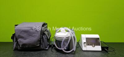 Mixed Lot Including 1 x DeVilbiss Homecare Suction Unit (Powers Up) with 1 x Power Supply in Carry Bag and 1 x Lowenstein Medical Prisma Smart CPAP Type WM090TD *Mfd 2021* (Powers Up) with 1 x Power Supply *SN 26048699 / PU129781*