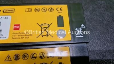 2 x Medtronic Lifepak 1000 Defibrillators *Mfd - 2016 / 2007* (Both Power Up) in Case with 2 x 3 Lead ECG Leads and 2 x Li/MnO2 Batteries *Install Before - 2027 / 2023* - 5