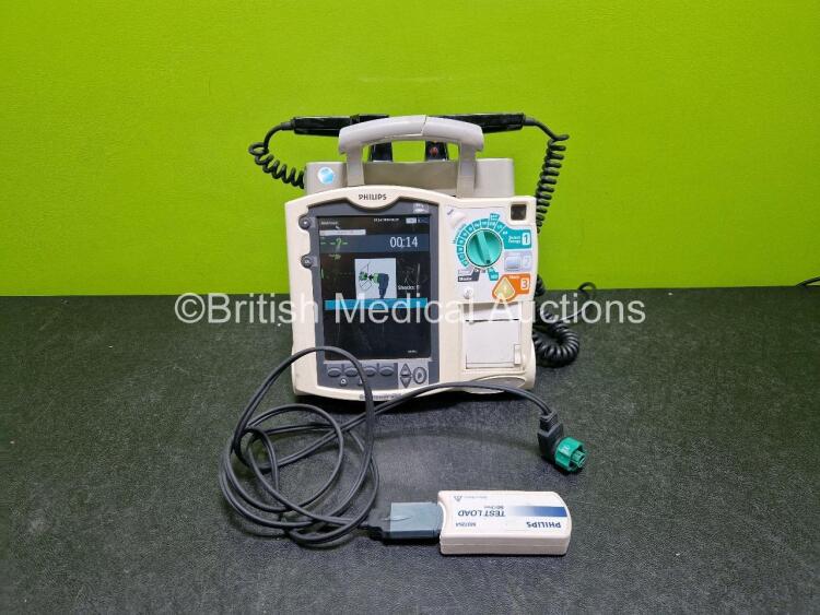 Philips Heartstart MRx Defibrillator (Powers Up, Crack in Handle - See Photo) Including Pacer, ECG and Printer Options with External Hard Paddles, 1 x Philips M3539A Module, 1 x Philips M3538A Li-Ion Battery, 1 x Paddle Lead and 1 x M3725A Test Load