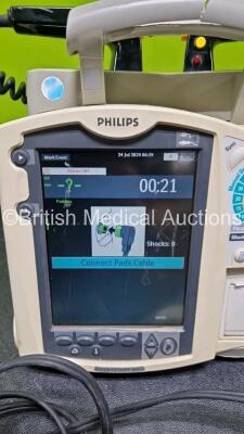 Philips Heartstart MRx Defibrillator (Powers Up, Crack in Handle - See Photo) Including Pacer, ECG and Printer Options with External Hard Paddles, 1 x Philips M3539A Module, 1 x Philips M3538A Li-Ion Battery, 1 x Paddle Lead and 1 x M3725A Test Load - 2