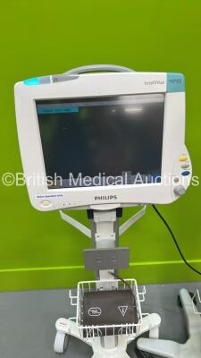 2 x Philips IntelliVue MP50 Patient Monitors on Stands with 1 x Philips M1013A Gas Module (Both Power Up) - 3