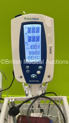 4 x Welch Allyn Spot Vital Signs Monitors on Stands (All Power Up, 1 x Detached from Stand) - 5