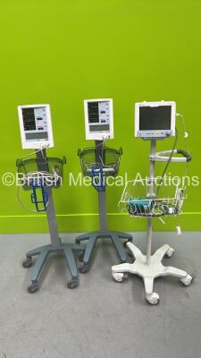 2 x Mindray Accutorr Plus Monitors on Stands (Both Power Up) and 1 x Datascope Trio Monitor on Stand (Damaged - No Power)