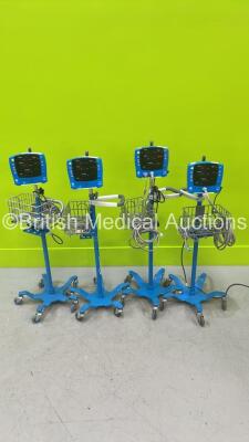 4 x GE Carescape V100 Vital Signs Monitors on Stands with 2 x Power Supplies (All Power Up)