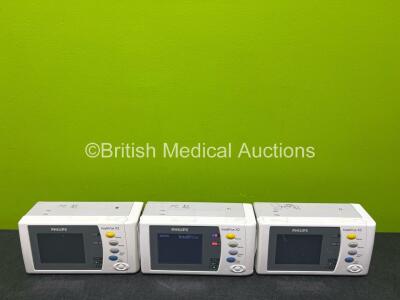 3 x Philips X2 Handheld Patient Monitors Including ECG, SpO2, NBP, Press and Temp Options with 3 x Philips M4607A Lithium ION Batteries (1 x Powers Up, 2 x No Power, 3 x Damage to Casing - See Photos) *DE315D1484 / DE037A9657 / DE037A9671*