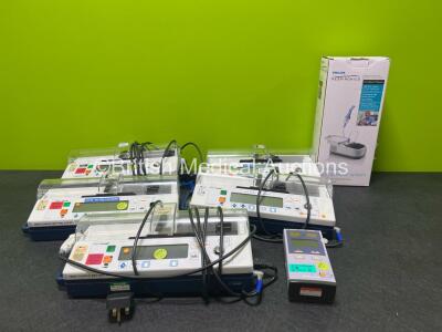 Mixed Lot Including 5 x CareFusion IVAC PCAM Syringe Pumps, 1 x Nellcor N-85 Handheld Monitor and 1 x Philips Respironics Nebulizer / Compressor System in Box (Like New) *SN 500109200 / 500112055 / 500109178 / 500109806 / 500112056 / 500112056*