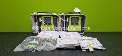 2 x Zoll AEDPro Defibrillators (Both Power Up, 1 x Cracked Screen - See Photo) in Carry Cases with 2 x 3 Lead ECG Leads and 2 x Li-ion Batteries and 4 x Electrodes (All Expired)