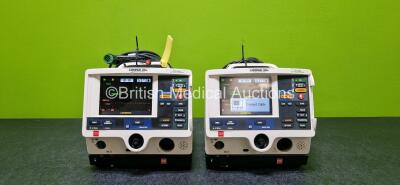 Job Lot Including 2 x Physio Control Lifepak 20e Defibrillator / Monitors (Both Power Up,1 x Damaged Handle and Both Missing Cases - See Photos) Including Pacer, ECG and Printer Options with 2 x Li-ion Batteries, 2 x Paddle Leads and 2 x 3 Lead ECG Leads 