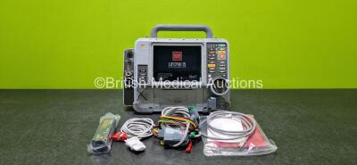 Physio-Control Lifepak 15 Monitor / Defibrillator *Mfd 2009* Ref 99577-000025, P/N - V15-2-000030 Including Auxiliary, Pacer, SpO2, CO2, NIBP, ECG and Printer Options (Powers Up Intermittently and Damaged Case - See Photos) with 1 x 4 Lead ECG Lead, 1 x T