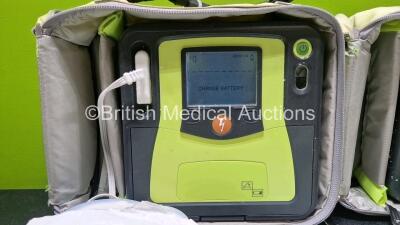 2 x Zoll AEDPro Defibrillators (Both Power Up, 1 x Cracked Screen - See Photo) in Carry Cases with 2 x 3 Lead ECG Leads, 4 x Li-ion Batteries and 3 x Electrodes *2 x Expired* - 3