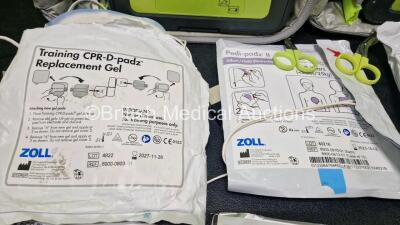 2 x Zoll AEDPro Defibrillators (Both Power Up, 1 x Cracked Screen - See Photo) in Carry Cases with 2 x 3 Lead ECG Leads, 4 x Li-ion Batteries and 3 x Electrodes *2 x Expired* - 7