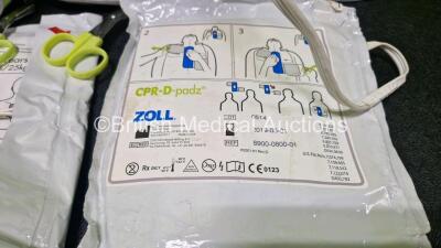 2 x Zoll AEDPro Defibrillators (Both Power Up, 1 x Cracked Screen - See Photo) in Carry Cases with 2 x 3 Lead ECG Leads, 4 x Li-ion Batteries and 3 x Electrodes *2 x Expired* - 9