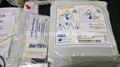 2 x Zoll AEDPro Defibrillators (Both Power Up) in Carry Cases with 1 x 3 Lead ECG Lead, 4 x Li-ion Batteries, 4 x Skintact ECG Electrodes *All in Date* and 3 x Electrodes - 8