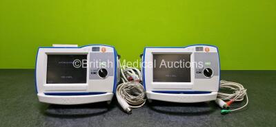 2 x Zoll R Series Plus Defibrillators / Monitors (Both Power Up) Including ECG and Printer Options with 2 x 3 Lead ECG Leads (1 x Damaged Casing - See Photos), 2 x Paddle Leads, 2 x Power Cords and 2 x Lithium Ion Rechargeable Batteries *SN AF13B027382 / 