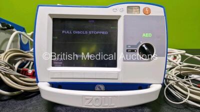 2 x Zoll R Series Plus Defibrillators / Monitors (Both Power Up) Including ECG and Printer Options with 2 x 3 Lead ECG Leads (Both Damaged Casings - See Photos), 2 x Paddle Leads, 2 x Power Cords and 2 x Lithium Ion Rechargeable Batteries *SN AF13B027395 - 4