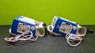 2 x Zoll R Series Plus Defibrillators / Monitors (Both Power Up) Including ECG and Printer Options with 2 x 3 Lead ECG Leads (Both Damaged Casings - See Photos), 2 x Paddle Leads, 2 x Power Cords and 2 x Lithium Ion Rechargeable Batteries *SN AF13B027395 - 10