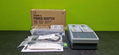 Job Lot Including 1 x Physio Control Ref 11141-000107 Mobile Li-ion Charger with 2 x Lithium Rechargeable Batteries (Powers Up and Damaged Case- See Photo) and 1 x Lifepak 15 Power Adapter Ref 11140-000074 *Like New in Box*