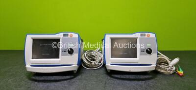 2 x Zoll R Series Plus Defibrillators / Monitors (Both Power Up) Including ECG and Printer Options with 2 x 3 Lead ECG Leads (1 x Damaged Casing - See Photos), 2 x Paddle Leads, 2 x Power Cords and 2 x Lithium Ion Rechargeable Batteries *SN AF13B027363 / 