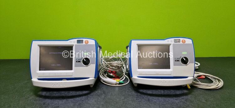 2 x Zoll R Series Plus Defibrillators / Monitors (Both Power Up) Including ECG and Printer Options with 2 x 3 Lead ECG Leads (Both Damaged Casings - See Photos), 2 x Paddle Leads, 2 x Power Cords and 2 x Lithium Ion Rechargeable Batteries *SN AF13B027383