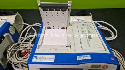 2 x Zoll R Series Plus Defibrillators / Monitors (Both Power Up) Including ECG and Printer Options with 2 x 3 Lead ECG Leads (Both Damaged Casings - See Photos), 2 x Paddle Leads, 2 x Power Cords and 2 x Lithium Ion Rechargeable Batteries *SN AF13B027383 - 6