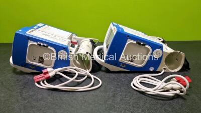 2 x Zoll R Series Plus Defibrillators / Monitors (Both Power Up) Including ECG and Printer Options with 2 x 3 Lead ECG Leads (Both Damaged Casings - See Photos), 2 x Paddle Leads, 2 x Power Cords and 2 x Lithium Ion Rechargeable Batteries *SN AF13B027383 - 9