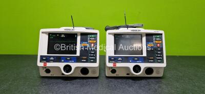 2 x Physio Control Lifepak 20e Defibrillators / Monitors (Both Power Up and 1 x Missing Label - See Photos) Including Pacer, ECG and Printer Options with 2 x Li-ion Batteries and 2 x Paddle Leads *SN 40270826 / NA*