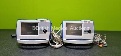 2 x Zoll R Series Plus Defibrillators / Monitors (Both Power Up) Including ECG and Printer Options with 2 x 3 Lead ECG Leads (1 x Damaged Casing - See Photos), 2 x Paddle Leads, 2 x Power Cords and 2 x Lithium Ion Rechargeable Batteries *SN AF13B027377 / 