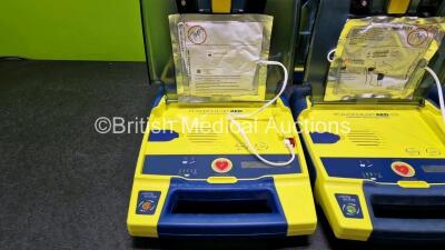 6 x Cardiac Science Powerheart AED G3 Automated External Defibrillators (All Power Up, 1 x Damaged Connector and 1 x Faulty Screen - See Photos) with 2 x LiSO2 Batteries and 5 x Electrodes *4 x Expired - 1 x Expiry Date 2025* *SN 4355000 / 4004321 / 36919 - 3