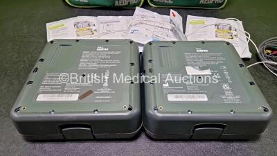 2 x Zoll AEDPro Defibrillators (Both Power Up) in Carry Cases with 2 x 3 Lead ECG Leads, 4 x Zoll Electrodes *2 x Expired* and 2 x LiMnO2 Batteries *SN AA14J033892 / AA09C013174* - 9