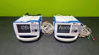 2 x Zoll R Series Plus Defibrillators / Monitors (Both Power Up) Including ECG and Printer Options with 2 x 3 Lead ECG Leads, 2 x Paddle Leads and 2 x Lithium Ion Rechargeable Batteries *SN AF13B027398 / AF13B027374* - 2