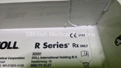 2 x Zoll R Series Plus Defibrillators / Monitors (Both Power Up) Including ECG and Printer Options with 2 x 3 Lead ECG Leads, 2 x Paddle Leads and 2 x Lithium Ion Rechargeable Batteries *SN AF13B027398 / AF13B027374* - 13