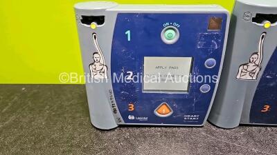 Job Lot Including 2 x Laerdal FR2+ Defibrillators and 1 x Philips FR2+ Defibrillator (All Power Up with Stock Battery Stock Battery Not Included) with 3 x 3 Lead ECG Leads - 2