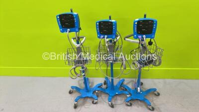 3 x GE Carescape V100 Vital Signs Monitors on Stands with 3 x Power Supplies (All Power Up)