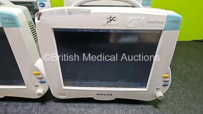 4 x Philips IntelliVue MP50 Patient Monitors (All Power Up, 3 x with Damage to Casing - See Photo) with 3 x Li-ion Batteries - 3