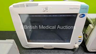 4 x Philips IntelliVue MP50 Patient Monitors (All Power Up, 3 x with Damage to Casing - See Photo) with 3 x Li-ion Batteries - 5