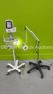 1 x Welch Allyn LXi Spot Vital Signs Monitor on Stand (Powers Up) and 1 x Brandon Mobile Examination Light (Powers Up - Damaged Arm - See Photo) *20100502882*