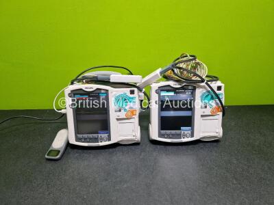 2 x Philips Heartstart MRx Defibrillator (Both Power Up) Including Pacer, ECG and Printer Options with 2 x Philips M3539A Modules, 2 x Philips M3538A Li-Ion Batteries, 2 x Paddle Lead, 1 x Laerdal QCPR Meter, 2 x M3725A Test Loads and 2 x 3 Lead ECG Lead