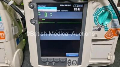 2 x Philips Heartstart MRx Defibrillator (Both Power Up) Including Pacer, ECG and Printer Options with 2 x Philips M3539A Modules, 2 x Philips M3538A Li-Ion Batteries, 2 x Paddle Lead, 1 x Laerdal QCPR Meter, 2 x M3725A Test Loads and 2 x 3 Lead ECG Lead - 2