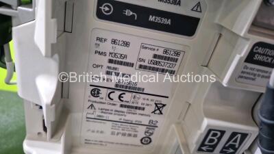 2 x Philips Heartstart MRx Defibrillator (Both Power Up) Including Pacer, ECG and Printer Options with 2 x Philips M3539A Modules, 2 x Philips M3538A Li-Ion Batteries, 2 x Paddle Lead, 1 x Laerdal QCPR Meter, 2 x M3725A Test Loads and 2 x 3 Lead ECG Lead - 8